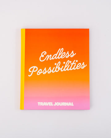 orange and pink ombre travel journal with white 'endless possibilities' typography across the front
