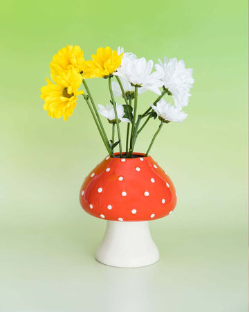 mushroom vase with red top and white polka dots and white stem