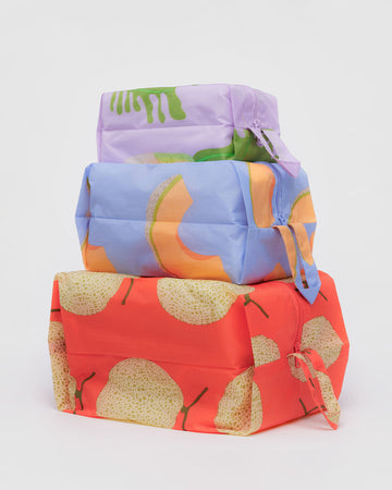 set of three 3D zip pouches: small dusty pink daikon, medium periwinkle cantaloupe, and large coral yubari 