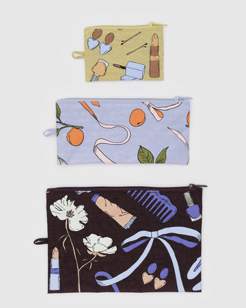 set of three flat pouch set: small yellow get ready with me, medium french blue apricot ribbons, and large chocolate plum get ready with me