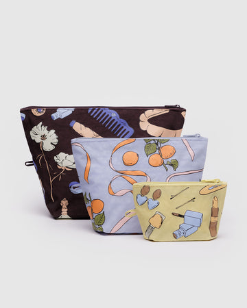 set of three go pouch set: small yellow get ready with me, medium french blue apricot ribbons, and large chocolate plum get ready with me