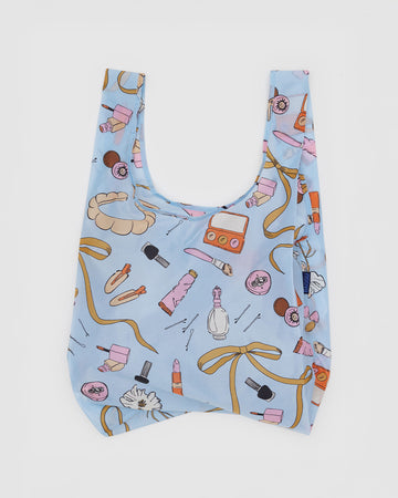light blue standard baggu with hair notions, makeup and bow print