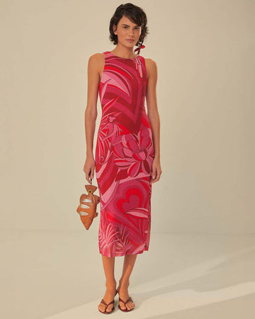 model wearing and pink and red abstract floral midi dress with tank sleeves