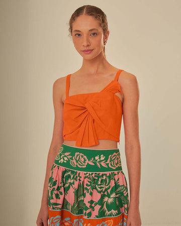 model wearing orange cropped tank with bow front detail on bust 