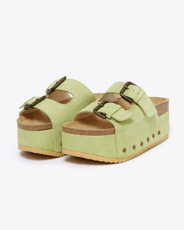 platform suede slide sandals with thick straps and metal buckle closures in pistachio green