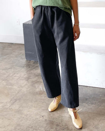 model wearing washed black cotton pants