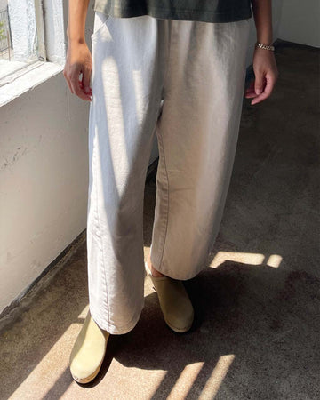 model wearing cream cotton pants