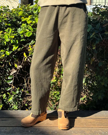 model wearing olive relaxed fit pants