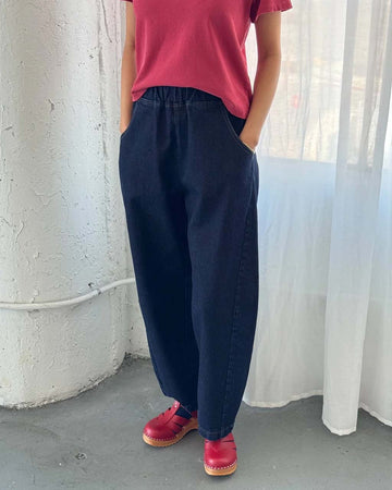 model wearing dark raw denim