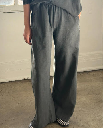 model wearing coal wide leg pants with side inlets