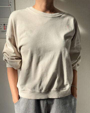 model wearing rice cali jersey sweatshirt with banded sleeves and bottom hem