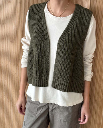 model wearing olive green knit open front sweater vest