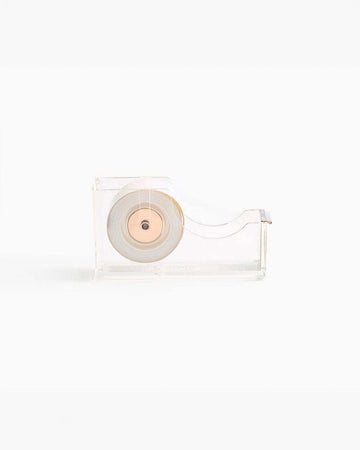 side view of clear lucite tape dispenser with gold accents