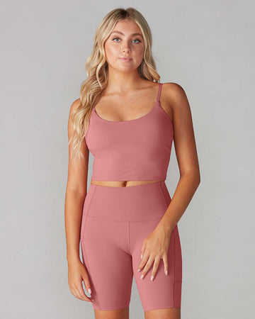 model wearing dark mauve cami bra and matching biker shorts