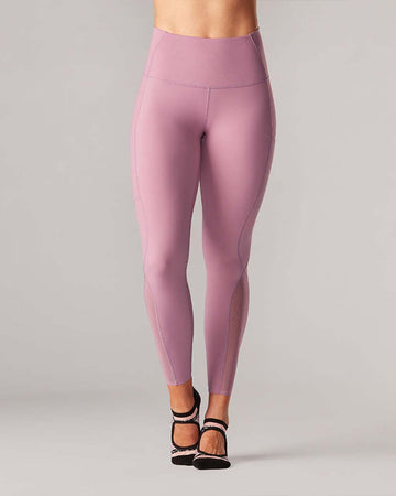 model wearing wisteria leggings with mesh legs and side pockets