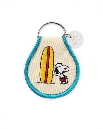 reverse side with snoopy standing with his surfboard
