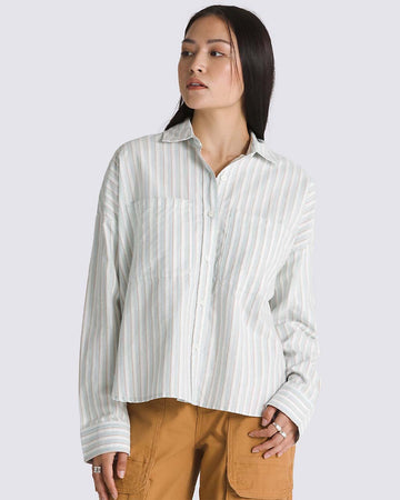 model wearing gray striped oxford style long sleeve shirt