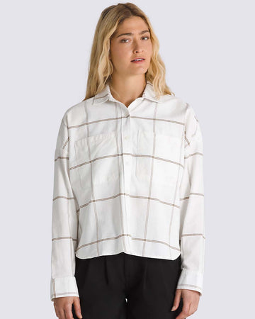 model wearing white oxford style long sleeve shirt with maroon grid plaid