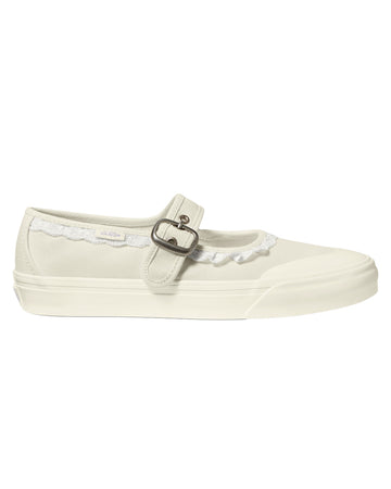 cream mary jane shoe with ruffle detail and strap with buckle