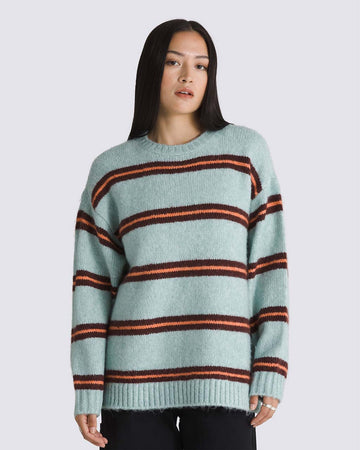 model wearing grey oversized sweater with burgundy and orange stripes