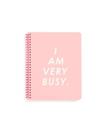 This Rough Draft Notebook comes in pink, with 'I Am Very Busy' printed in white letters across the front.