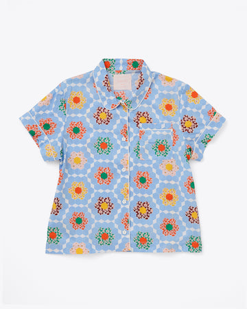short sleeve pajama shirt in blue patchwork quilt pattern with white piping detail